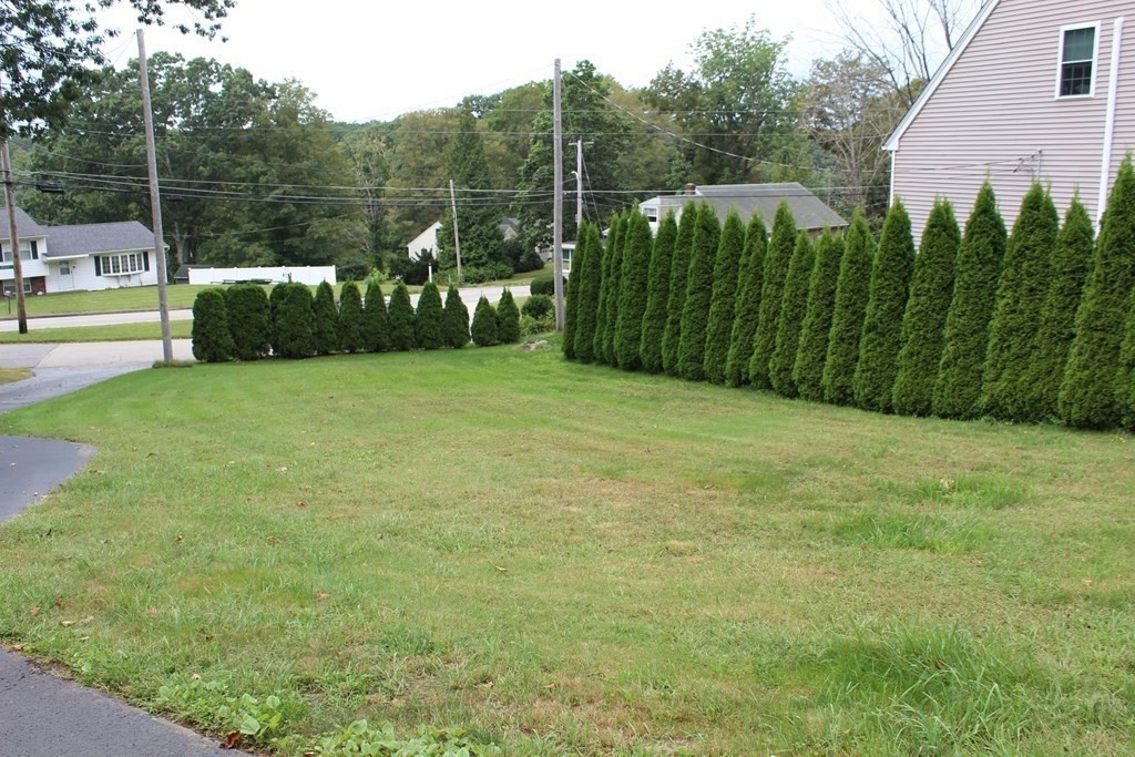 117 Mine Brook Road Webster, MA 01570 - Photo 18 of 21 a view of a garden with a building in the background