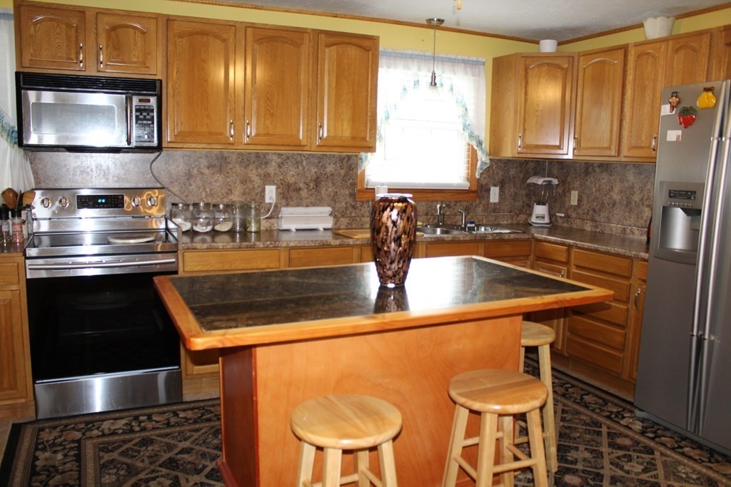 117 Mine Brook Road Webster, MA 01570 - Photo 4 of 21 a kitchen with a sink and a stove top oven
