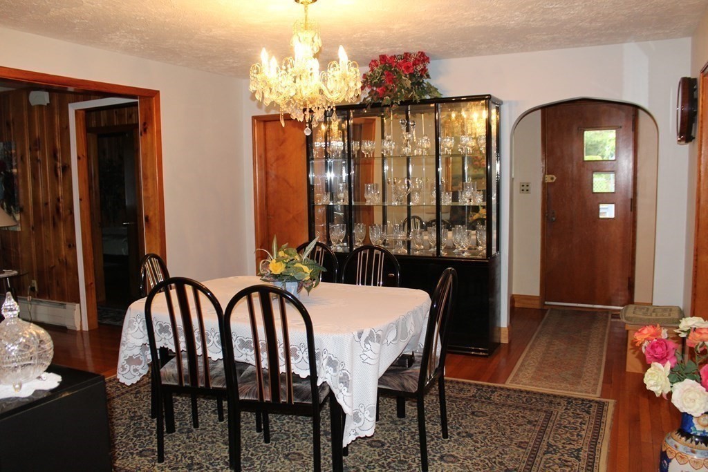 117 Mine Brook Road Webster, MA 01570 - Photo 8 of 21 a view of a dining room with furniture and chandelier