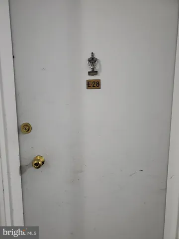 a kitchen with wooden cabinets and a sink