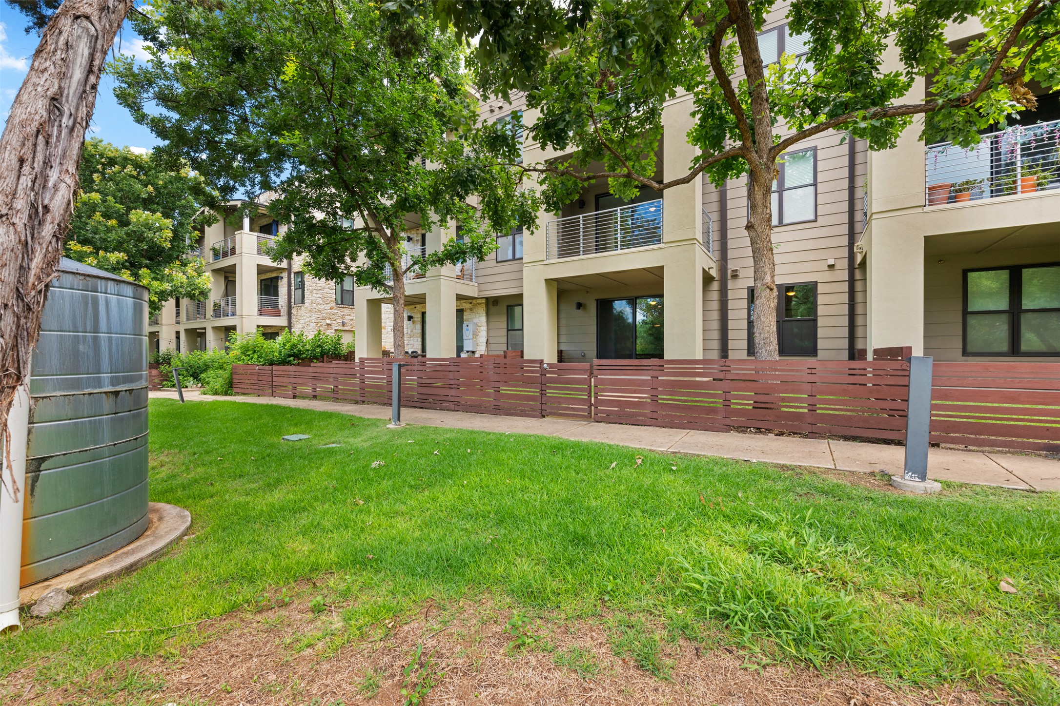 2804 Treble Lane, Unit 902 Austin, TX 78704 - Photo 28 of 31 a house view with a garden space