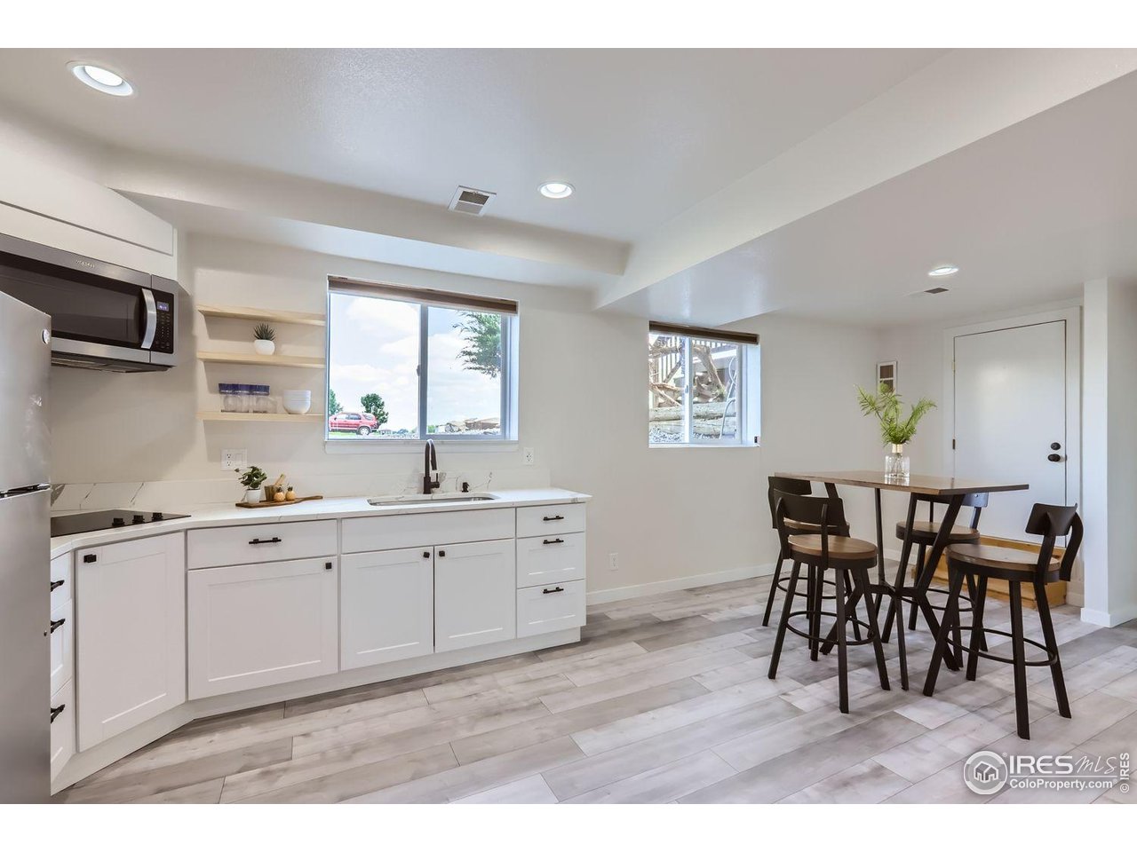 128 Carpenter Road Fort Collins, CO 80525 - Photo 23 of 44 Wet bar with full fridge, cabinets and more!