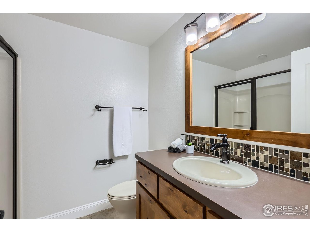 128 Carpenter Road Fort Collins, CO 80525 - Photo 29 of 44 Lower level walk in shower bathroom but there is also another 1/2 bath!