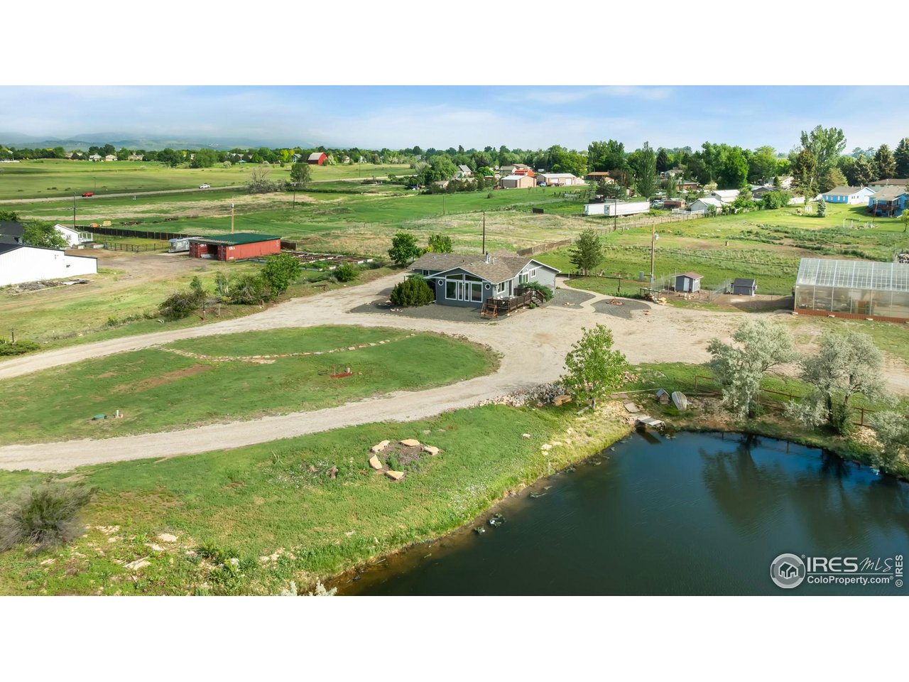 128 Carpenter Road Fort Collins, CO 80525 - Photo 41 of 44 Fire pit by the water.