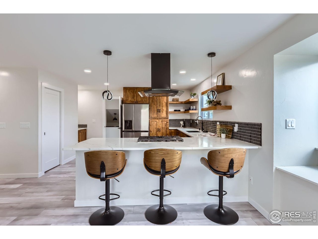 128 Carpenter Road Fort Collins, CO 80525 - Photo 7 of 44 Spacious kitchen w/ beautiful quartz counter tops.