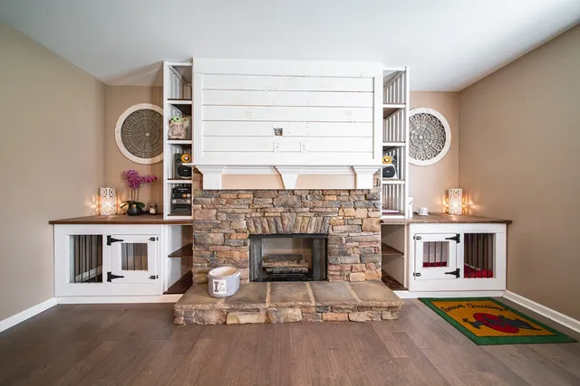 a living room with furniture and a fireplace