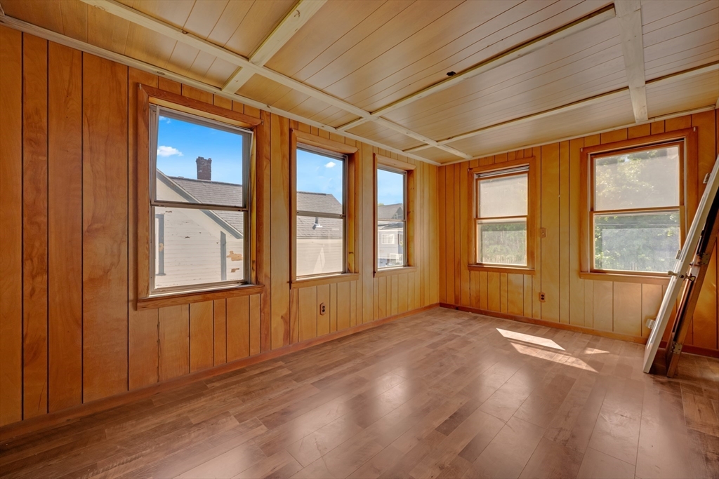 47 Morris Street Southbridge, MA 01550 - Photo 17 of 40 an empty room with wooden floor and windows