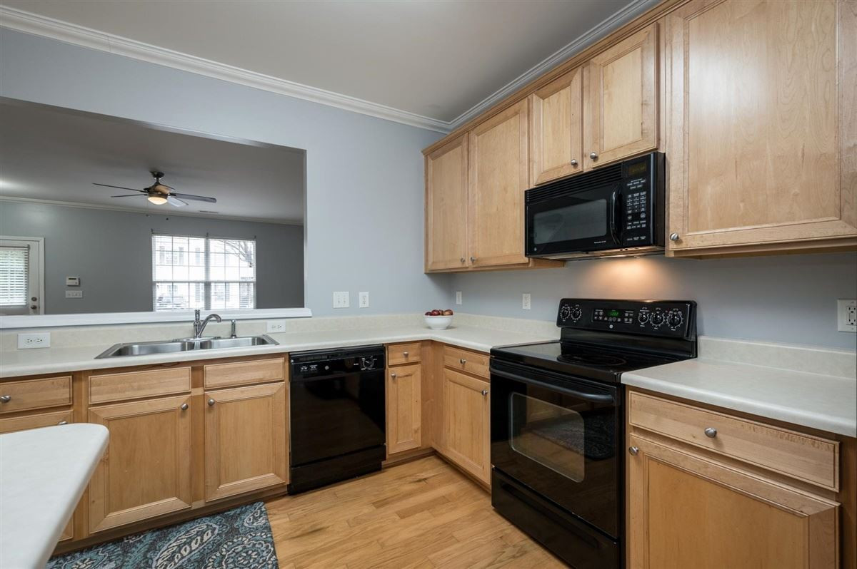 8311 Clasara Circle Raleigh, NC 27613 - Photo 15 of 27 Beautiful kitchen boasts maple cabinets, plenty of counter space, island, and separate pantry. Kitchen