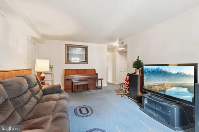 a room with furniture a washer and dryer