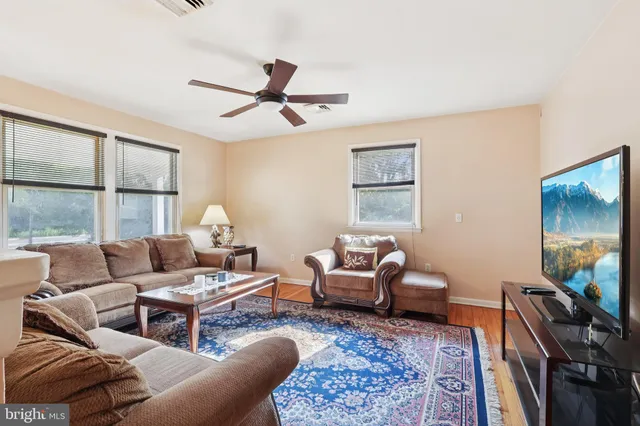 a living room with furniture and a rug
