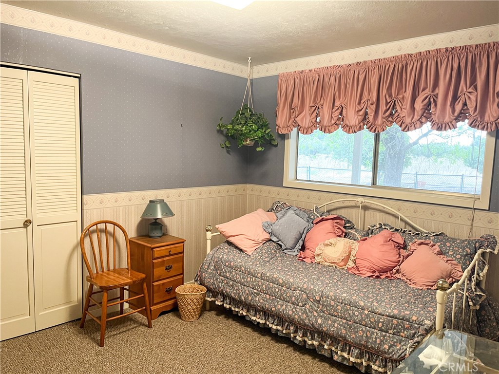 3665 Woodson Avenue Corning, CA 96021 - Photo 13 of 30 a bedroom with a bed and a window
