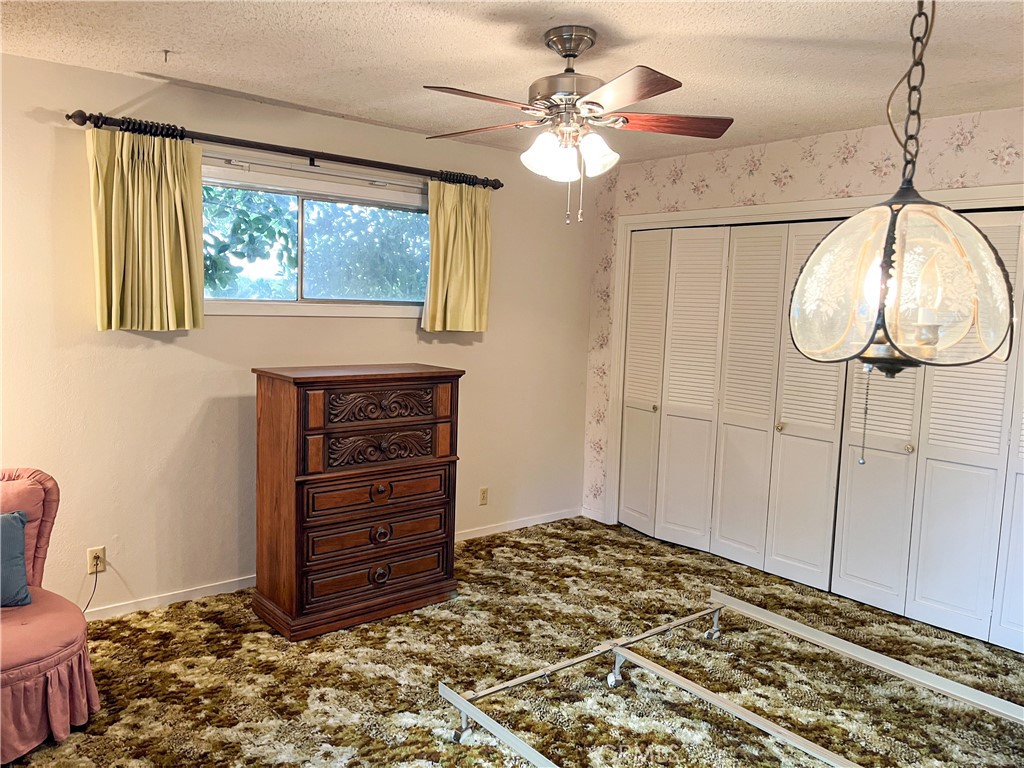 3665 Woodson Avenue Corning, CA 96021 - Photo 17 of 30 a bed room with a bed and a window