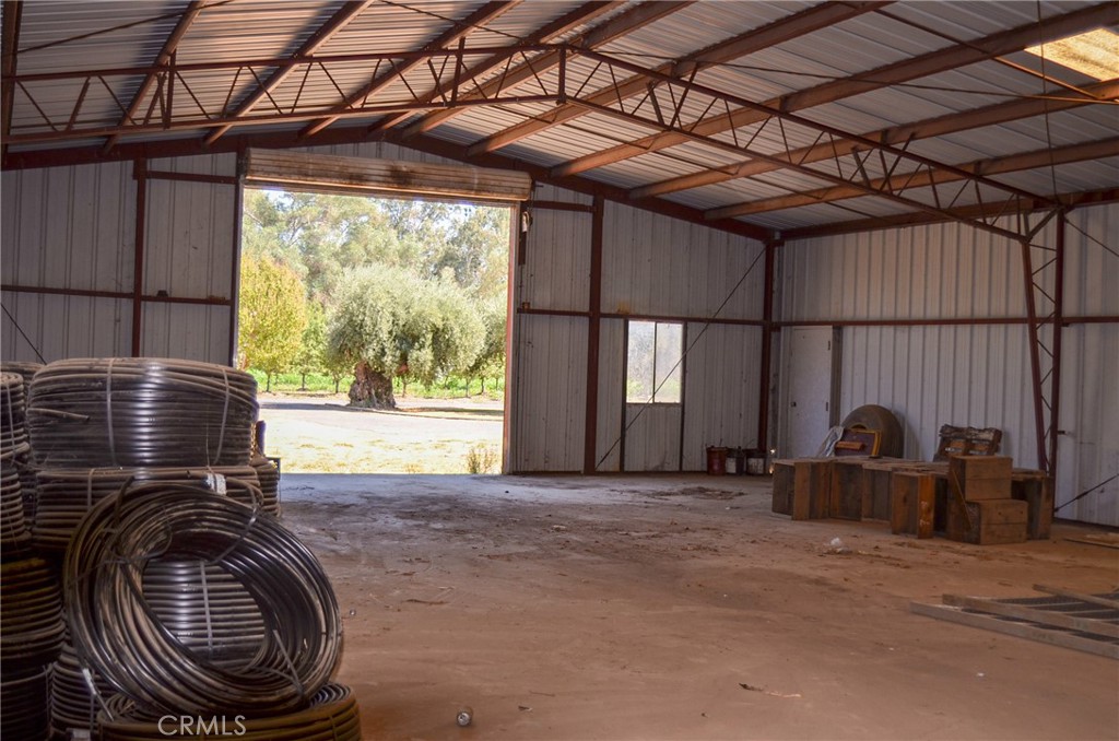 3665 Woodson Avenue Corning, CA 96021 - Photo 24 of 30 a view of a room with furniture water heater and wooden floor