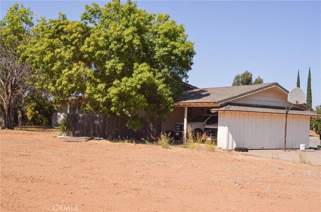 3665 Woodson Avenue Corning, CA 96021 - Photo 3 of 30 a view of a house with a yard covered in snow