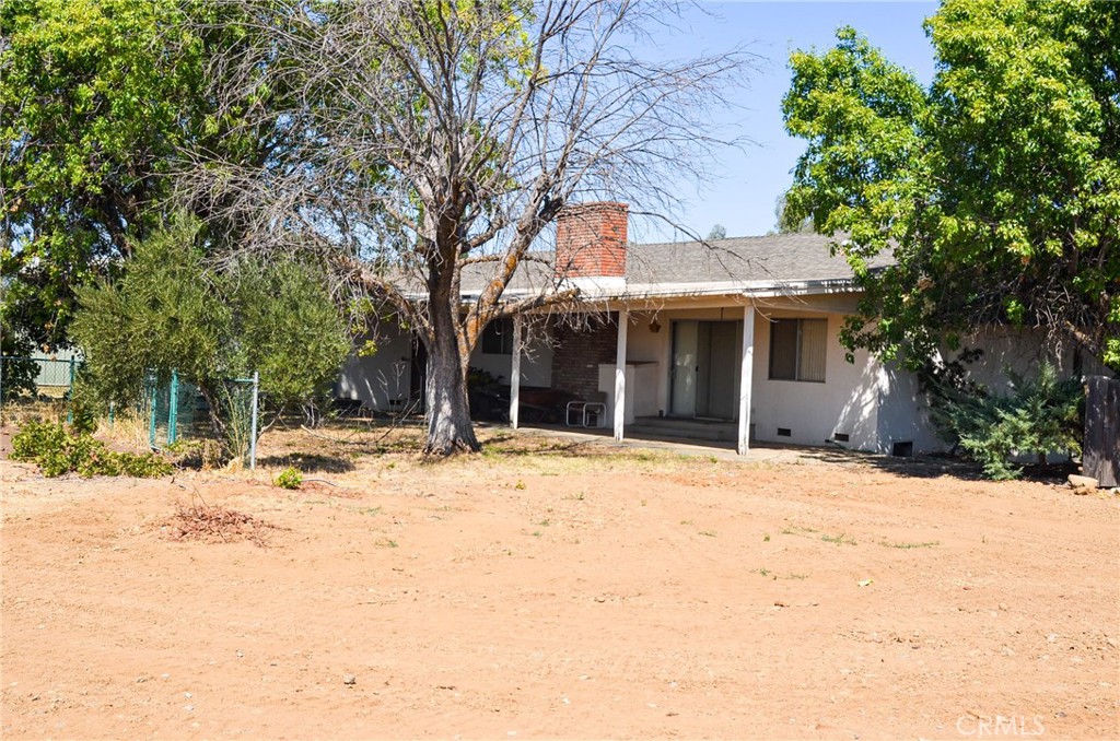 3665 Woodson Avenue Corning, CA 96021 - Photo 4 of 30 a view of a house with a yard covered in snow