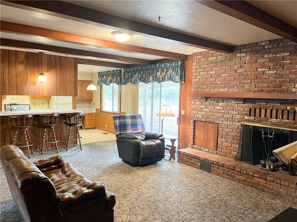 3665 Woodson Avenue Corning, CA 96021 - Photo 7 of 30 a living room with furniture and a fireplace
