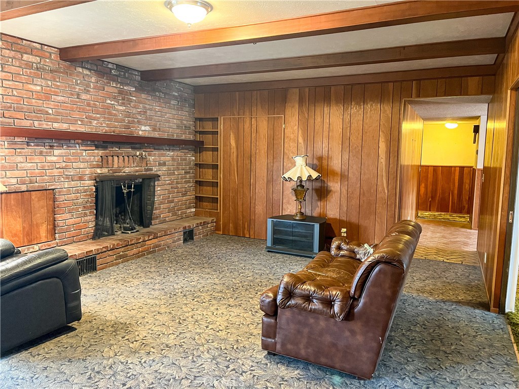 3665 Woodson Avenue Corning, CA 96021 - Photo 10 of 30 a living room with furniture and a fireplace