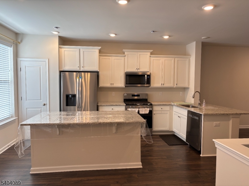 10 Stanton Rd Mount Mount Holly, NJ 08060 - Photo 3 of 9 a kitchen with stainless steel appliances granite countertop a refrigerator a stove and a sink