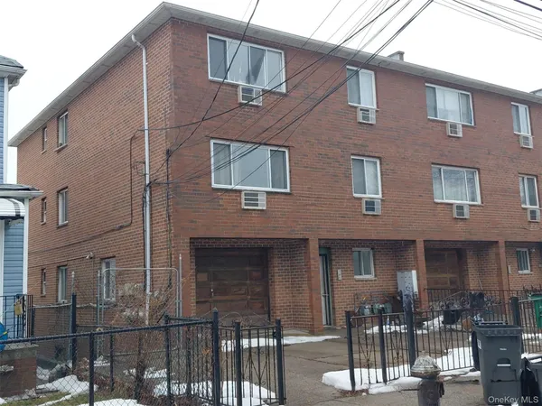 a front view of a building with glass windows
