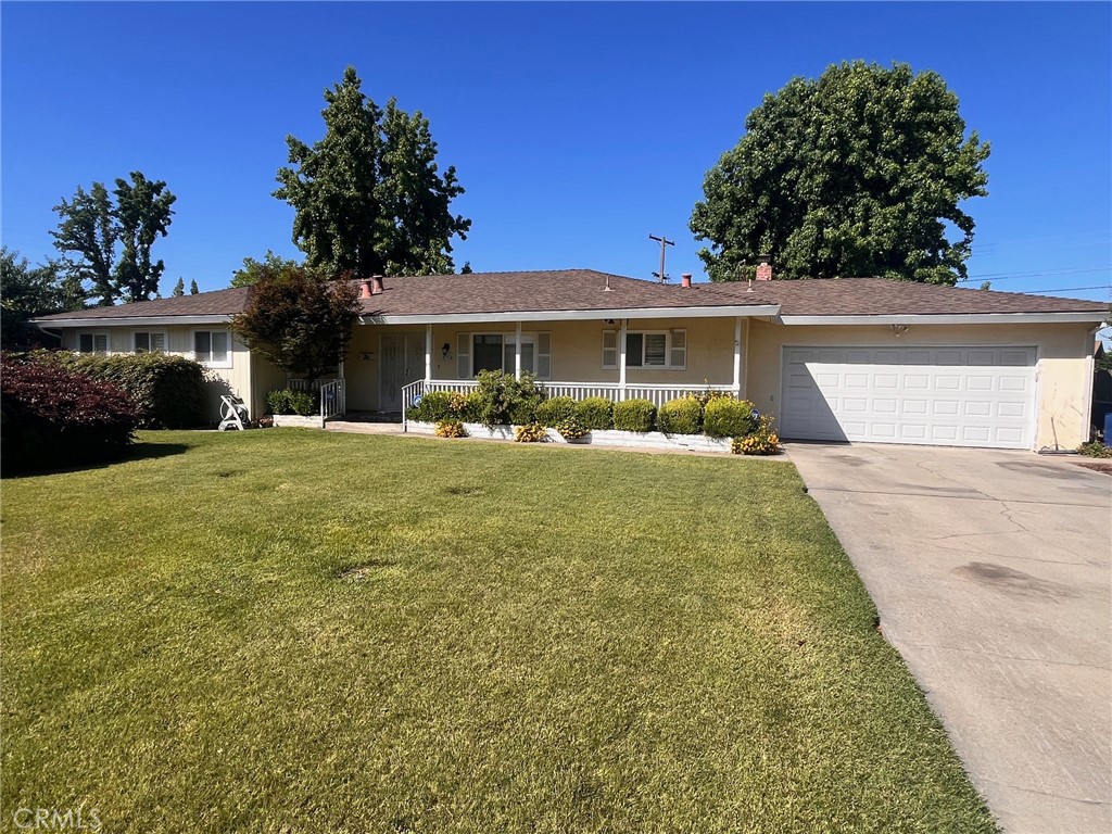 538 Village Court Merced, CA 95340 - Photo 2 of 17 a front view of house with yard and green space