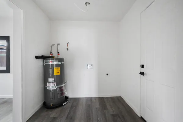 a view of hallway with wooden floor
