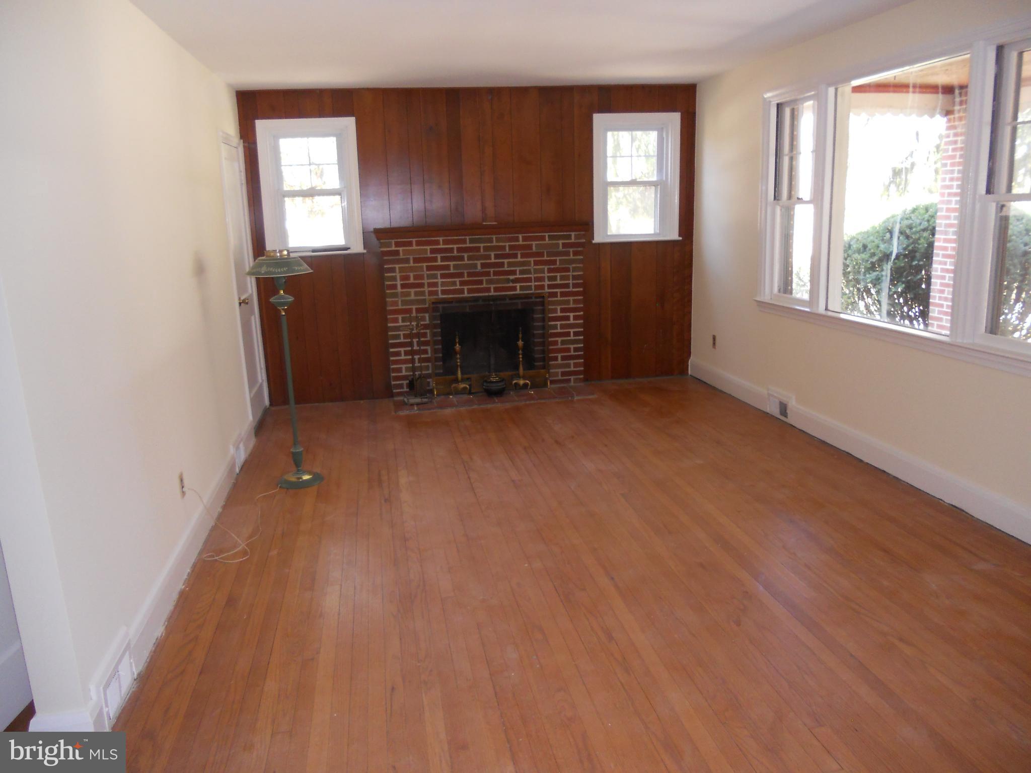 12912 Fork Road Baldwin, MD 21013 - Photo 5 of 6 Living Room and wood burning fireplace