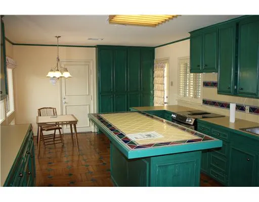 a room with pool table and windows