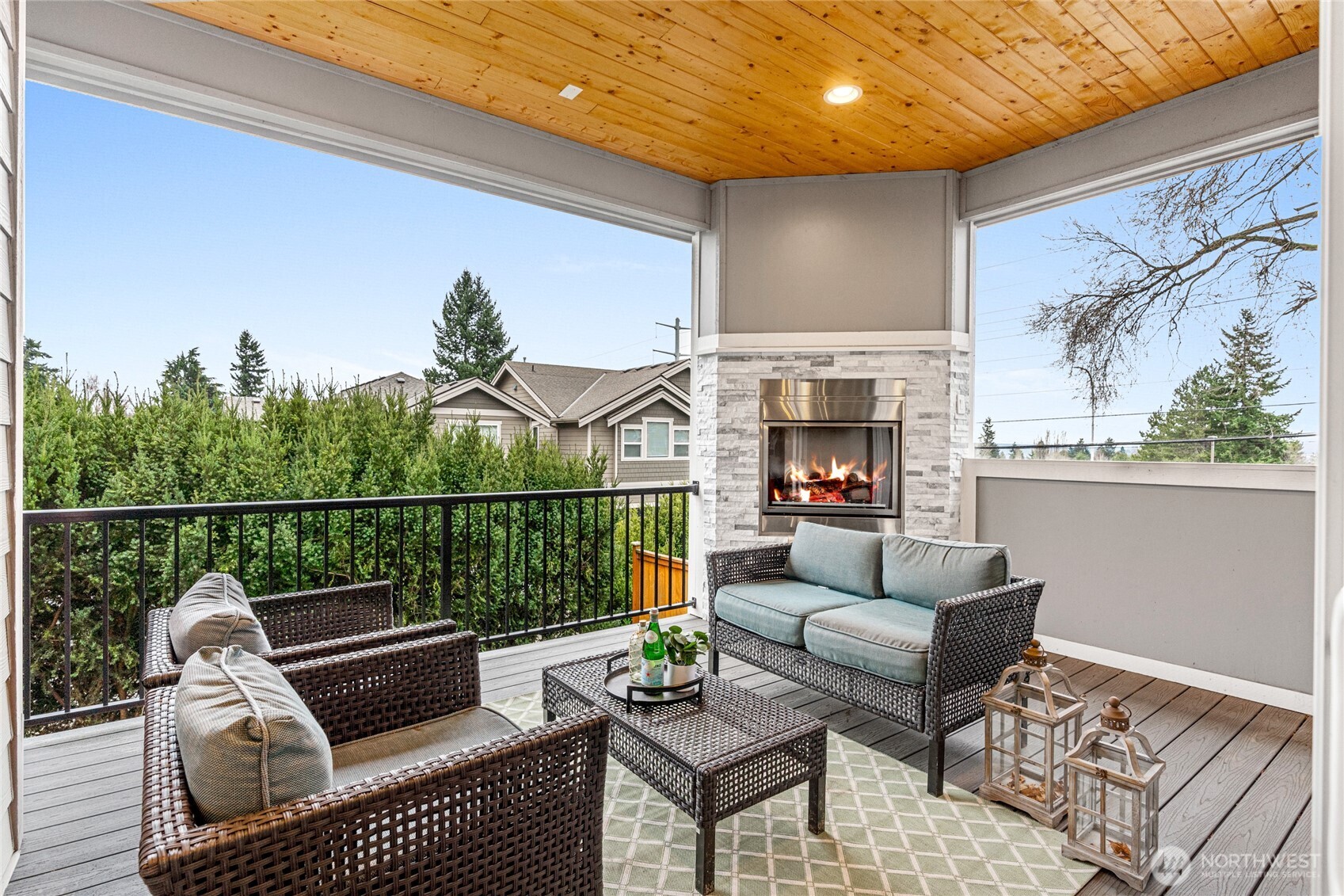 3303 Northeast 7th Street Renton, WA 98056 - Photo 11 of 25 a outdoor living space with patio furniture and a fireplace