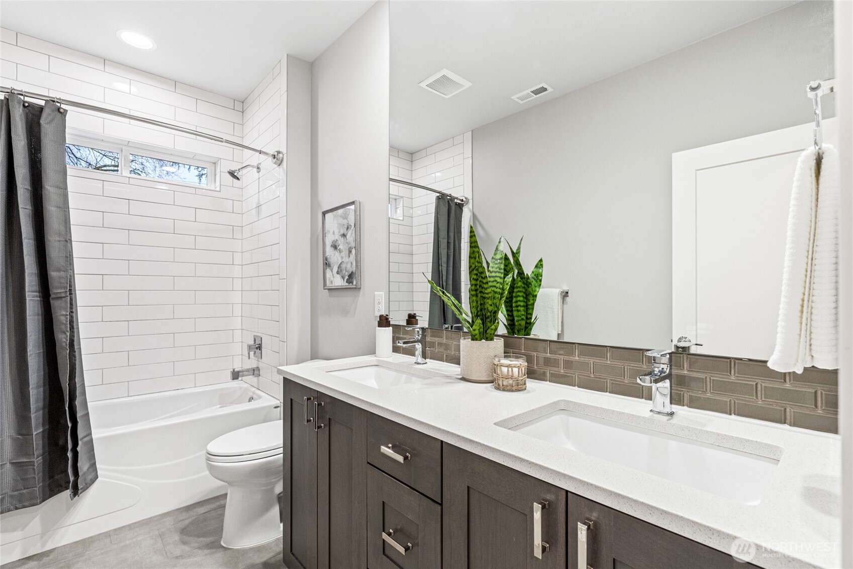 3303 Northeast 7th Street Renton, WA 98056 - Photo 17 of 25 a bathroom with a granite countertop sink toilet and shower