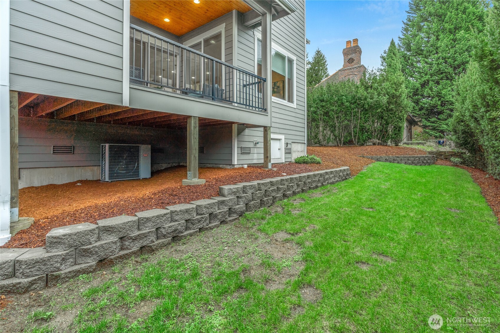 3303 Northeast 7th Street Renton, WA 98056 - Photo 20 of 25 a view of a house with a yard and sitting area