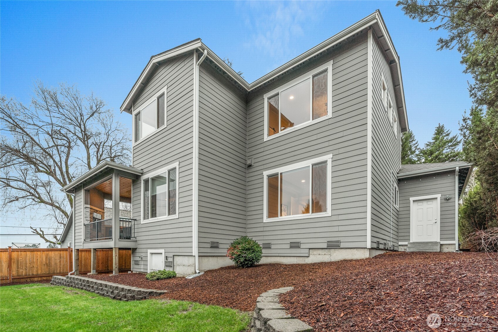 3303 Northeast 7th Street Renton, WA 98056 - Photo 21 of 25 a front view of a house with a yard