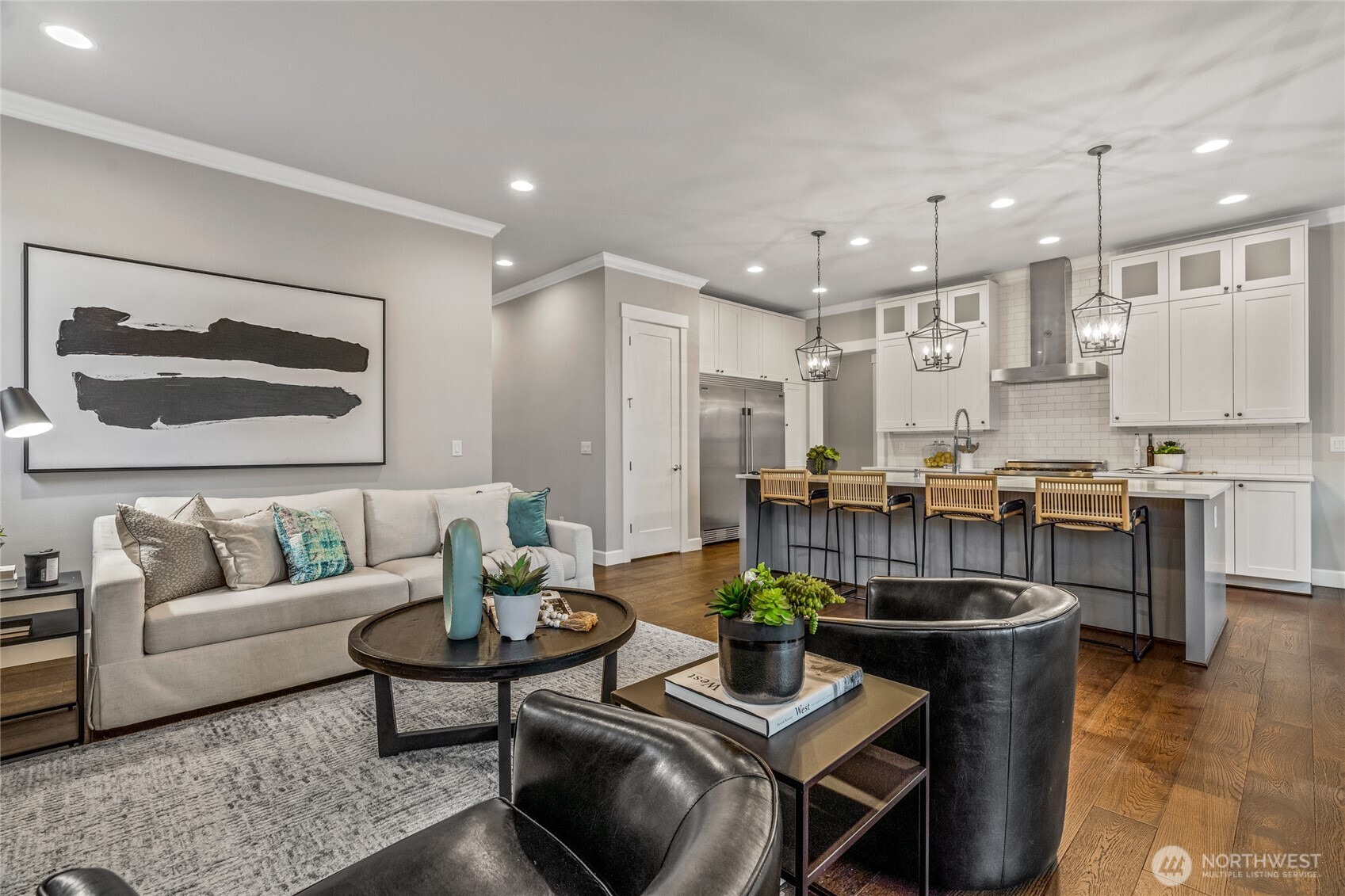 3303 Northeast 7th Street Renton, WA 98056 - Photo 3 of 25 a living room with couches and kitchen view with wooden floor