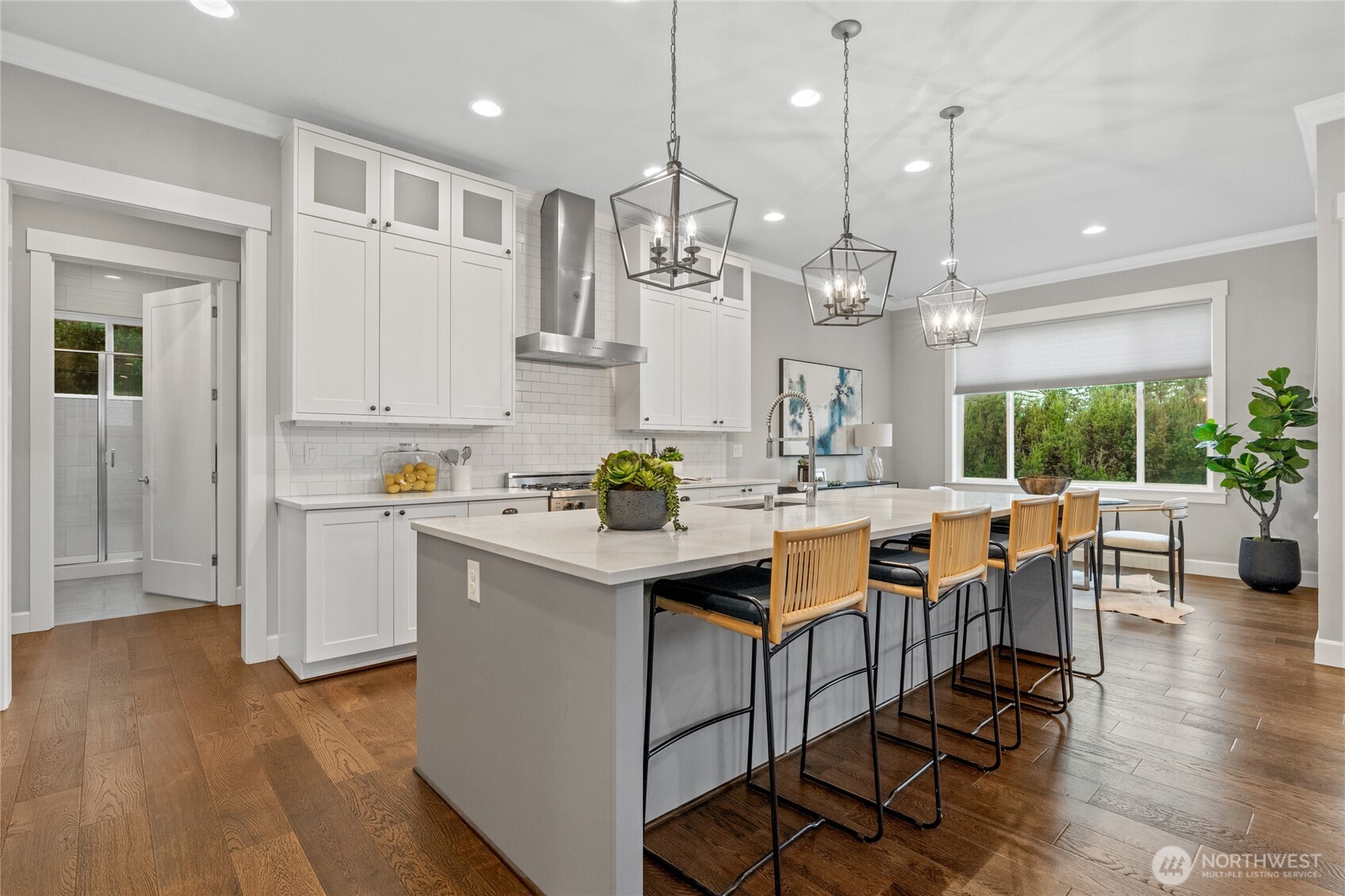3303 Northeast 7th Street Renton, WA 98056 - Photo 6 of 25 a open kitchen with white cabinets and stainless steel appliances
