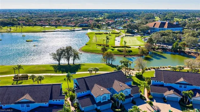 an aerial view of a house with a swimming pool outdoor seating and yard