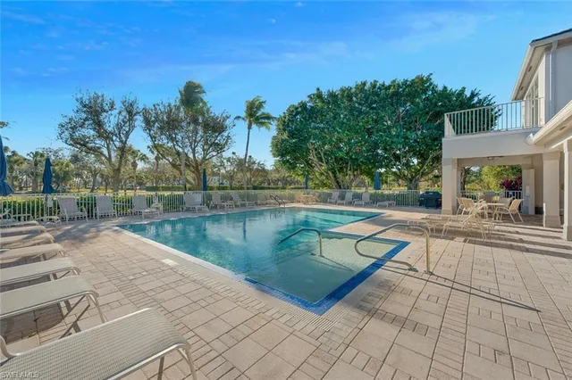 a view of a swimming pool with a patio
