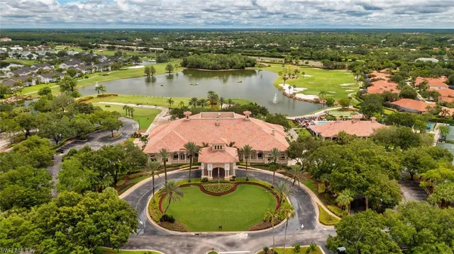 an aerial view of a house with a lake view