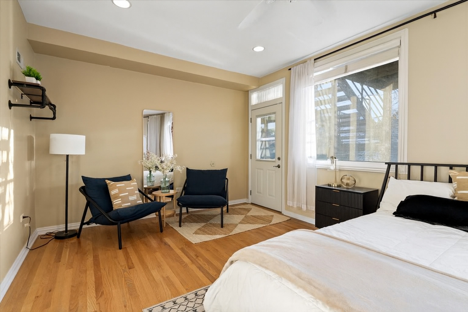 2642 North Racine Avenue, Unit 2N Chicago, IL 60614 - Photo 13 of 22 a bedroom with a bed and wooden floor