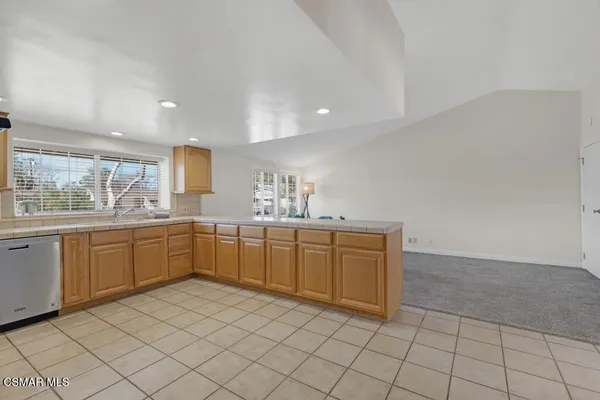 a kitchen with sink cabinets and window