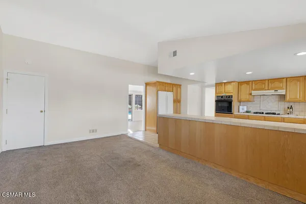 a view of a kitchen with a sink and cabinets