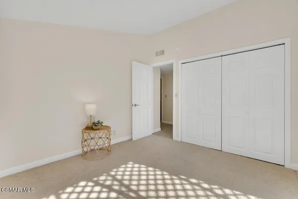 a view of an empty room and wooden floor
