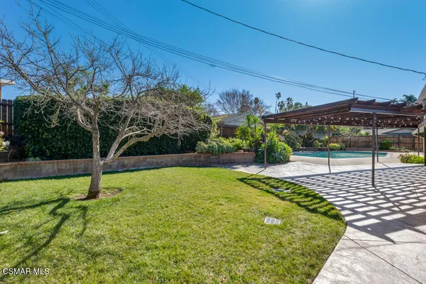 a view of swimming pool with a patio