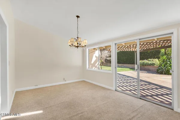 a view of empty room with windows