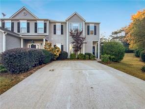 1533 Gathering Place Cumming, GA 30040 - Photo 1 of 1 a front view of a house with garden