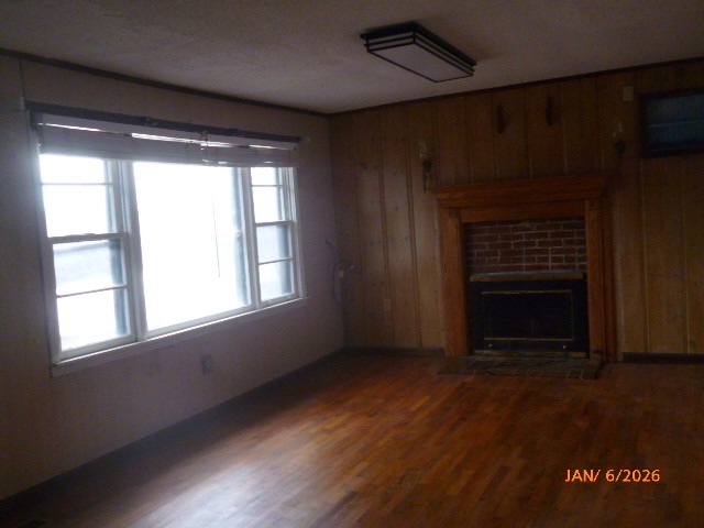 14765 Highway 70 East Huntingdon, TN 38344 - Photo 10 of 11 an empty room with wooden floor fireplace and windows