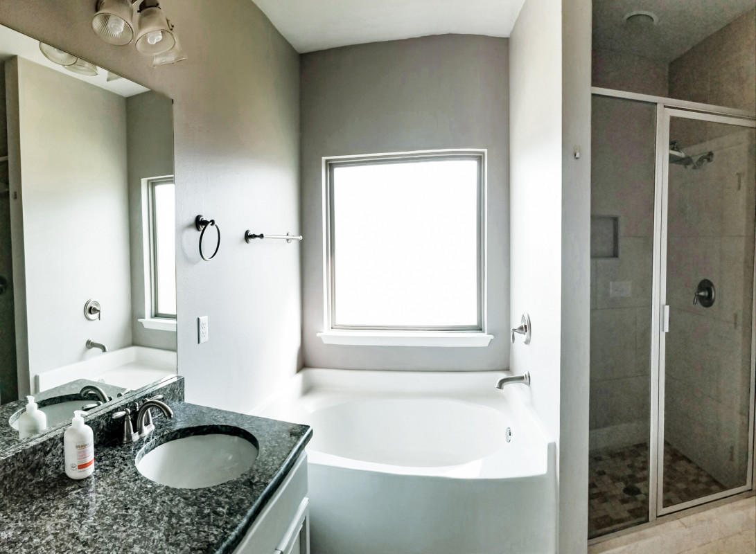 118 Pin Oak Loop Santa Rosa Beach, FL 32459 - Photo 11 of 15 a bathroom with a granite countertop tub sink and mirror