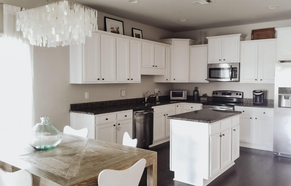 118 Pin Oak Loop Santa Rosa Beach, FL 32459 - Photo 5 of 15 a kitchen with stainless steel appliances granite countertop a sink a stove and cabinets
