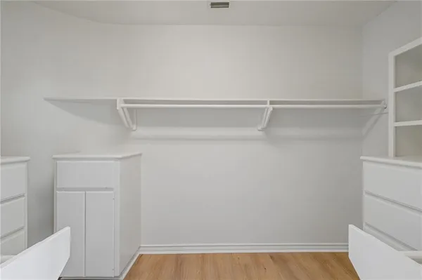 a view of an empty walk in closet