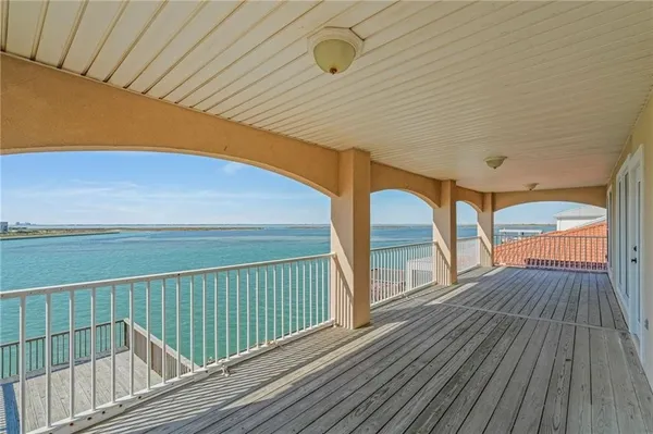 a view of balcony with wooden floor