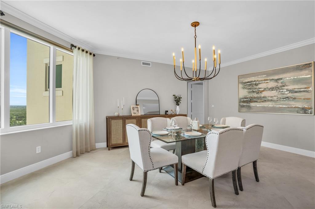 265 Indies Way, Unit 1402 Naples, FL 34110 - Photo 17 of 44 Dining area featuring a notable chandelier and ornamental molding