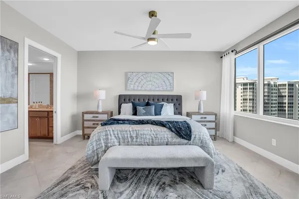 a bedroom with a large bed and a window